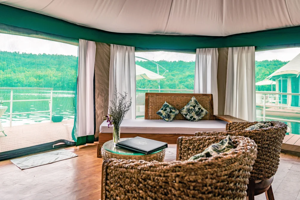 Table and chairs in a floating tent at Canvas and Orchids Retreat