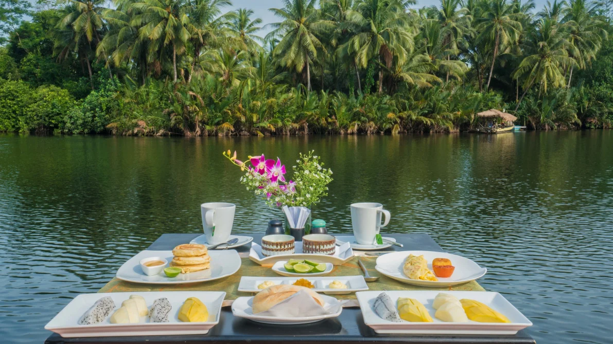 Dinning on the river at canvas and orchids Retreat