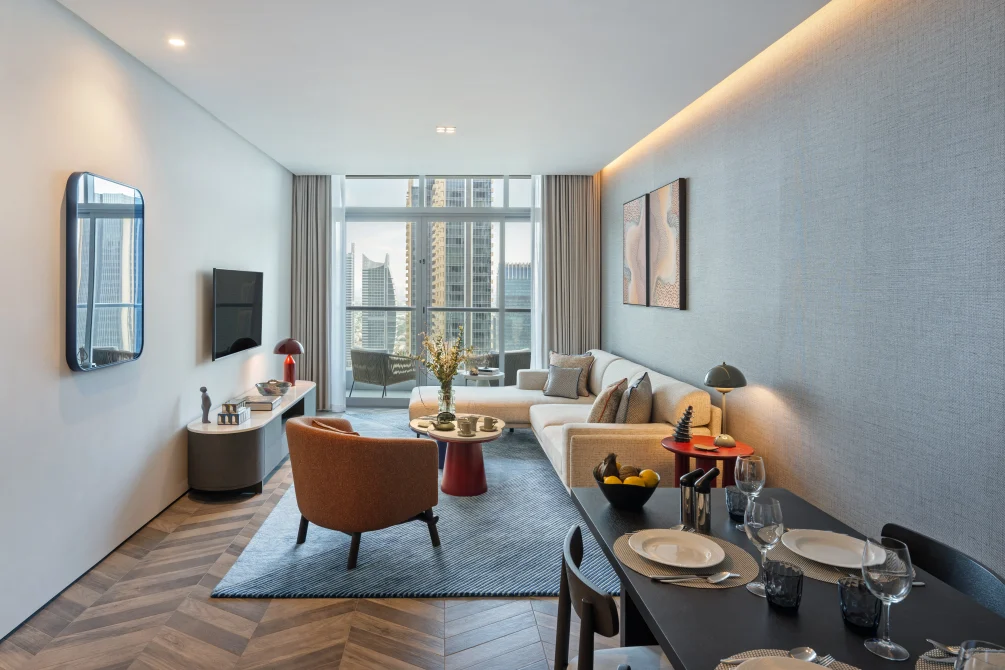 Suite living and dining area with balcony and city views at InterContinental Dubai Marina