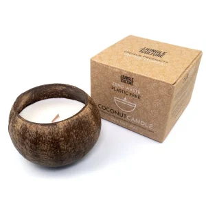 Natural Coconut Candle by Jungle Culture in a sustainable coconut shell vessel with lid, displayed next to its kraft paper eco-friendly packaging.