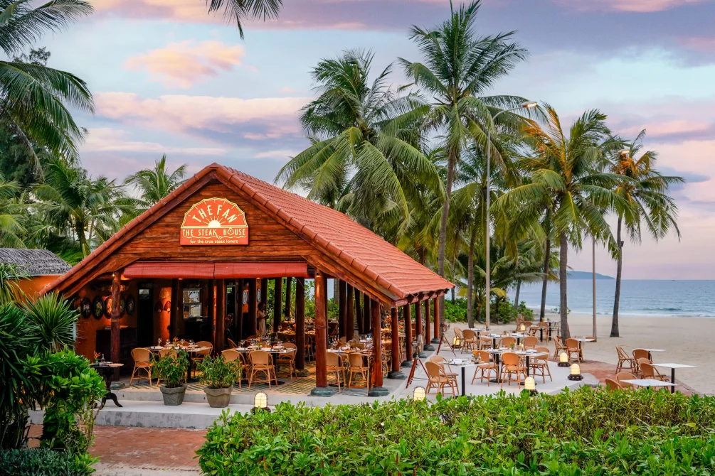 Furama Resort Danang_ House with palms