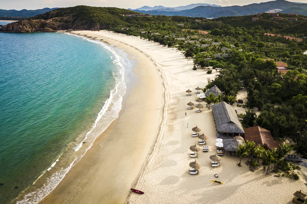 Aerial view of the beach and turquoise bay at Zannier Bãi San Hô, Vietnam