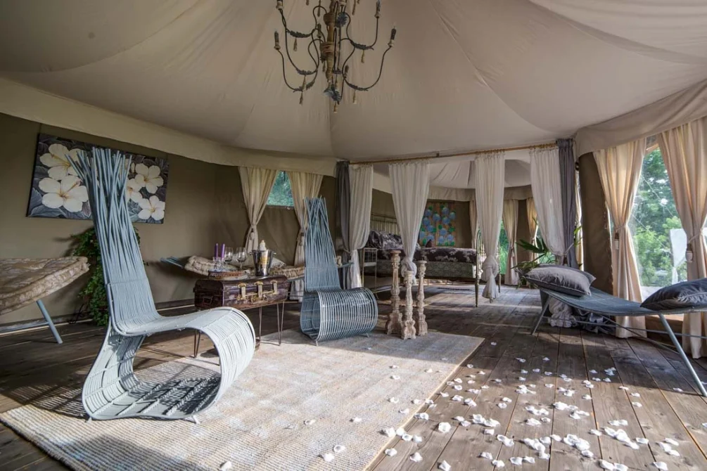 Glamping Canonici di San Marco tented villa with long chairs