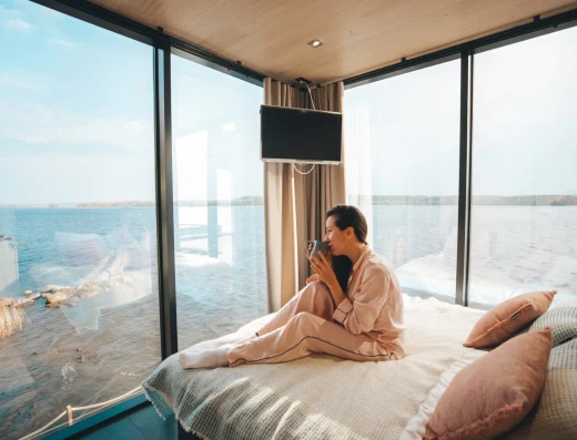 Lehmonkarki resort a couple on a bed by Julia Kivela